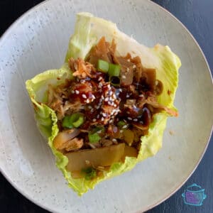 looking down on chicken in a lettuce bowl