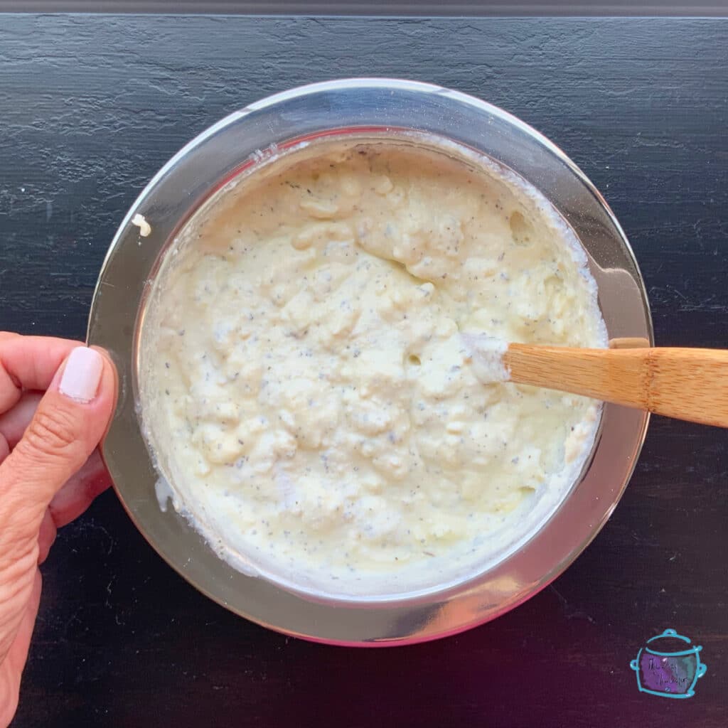 cheese mixture in a silver bowl