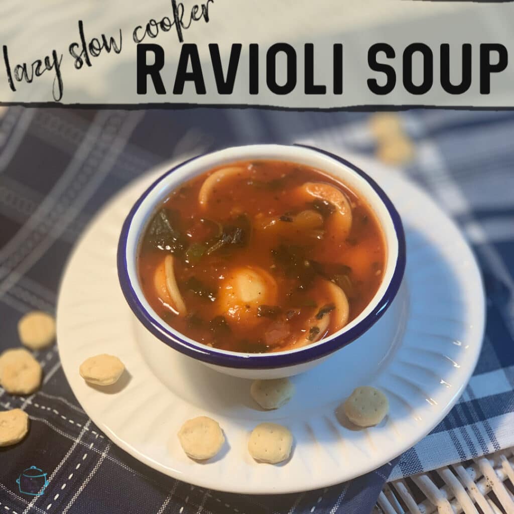 a bowl of soup with ravioli and spinach