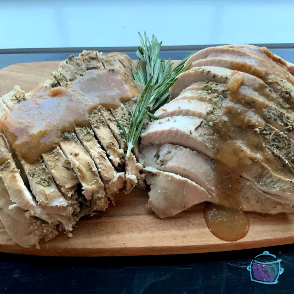 Turkey breast sliced and ready to serve with gravy on top