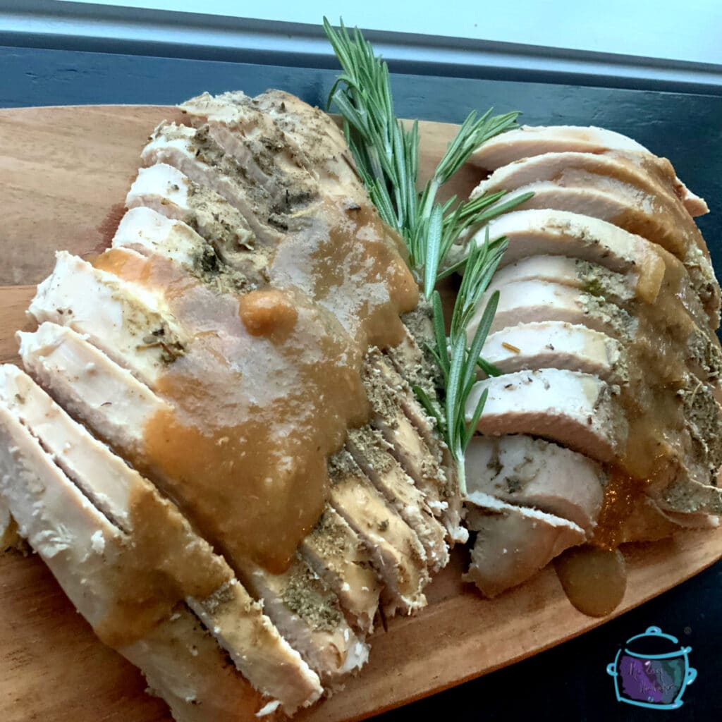 looking down on sliced slow cooker bone-in turkey breast with gravy