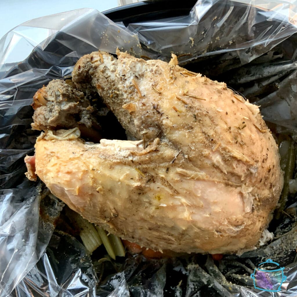 top view of slow cooked bone-in turkey breast still in slow cooker