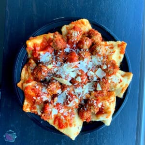 Looking down on a bowl ravioli and meatballs