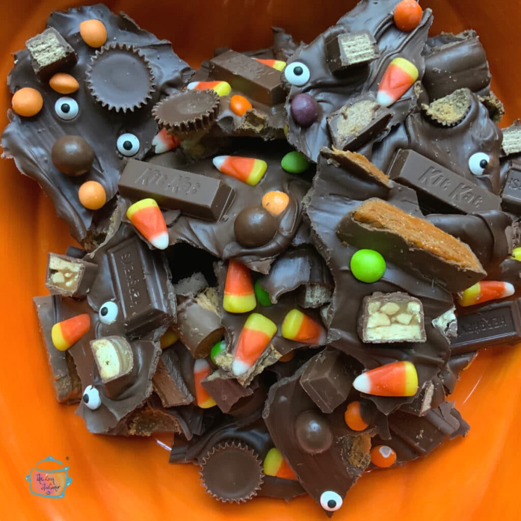 Slow cooker leftover candy bark in a pumpkin bowl