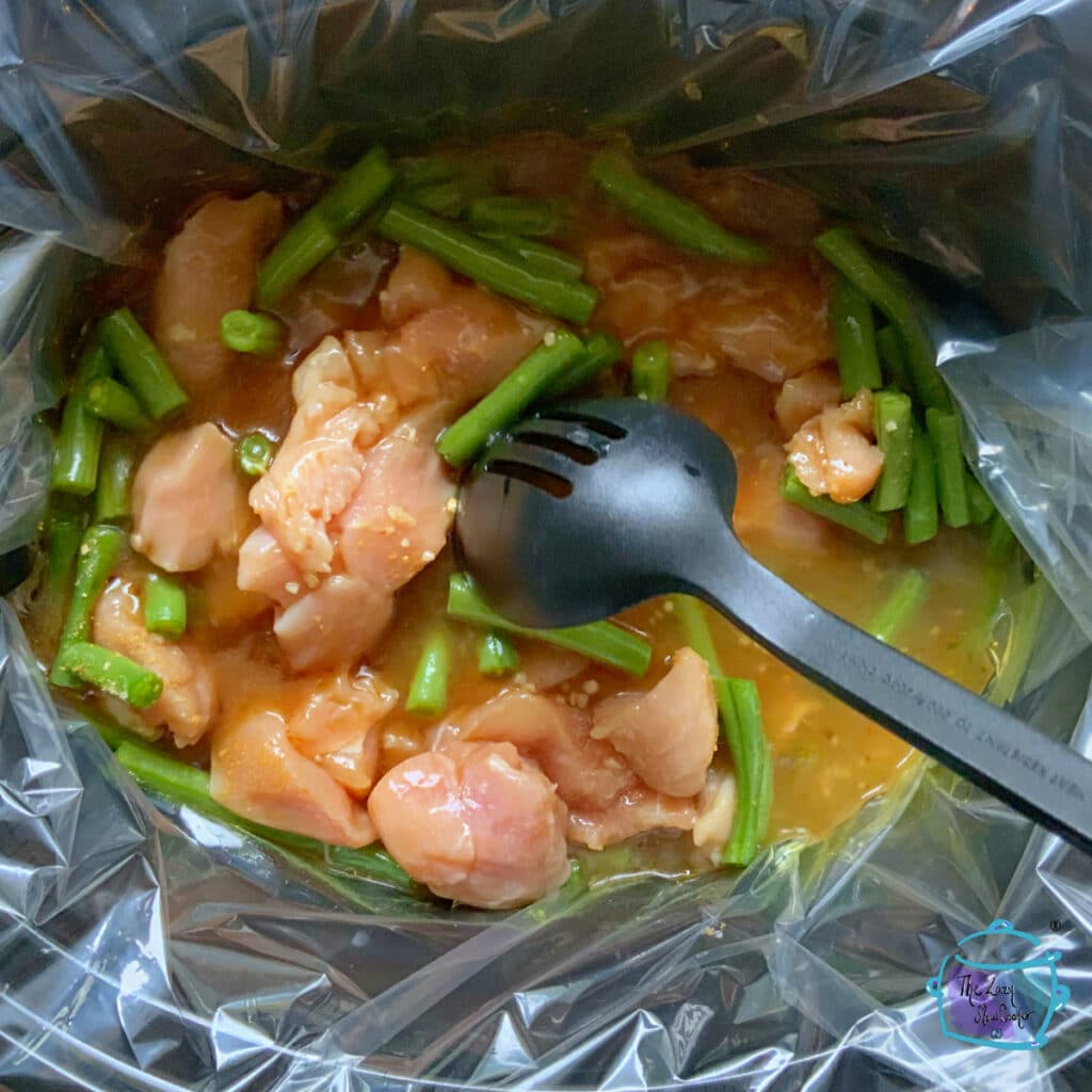 All mandarin chicken ingredients in slow cooker before cooking.