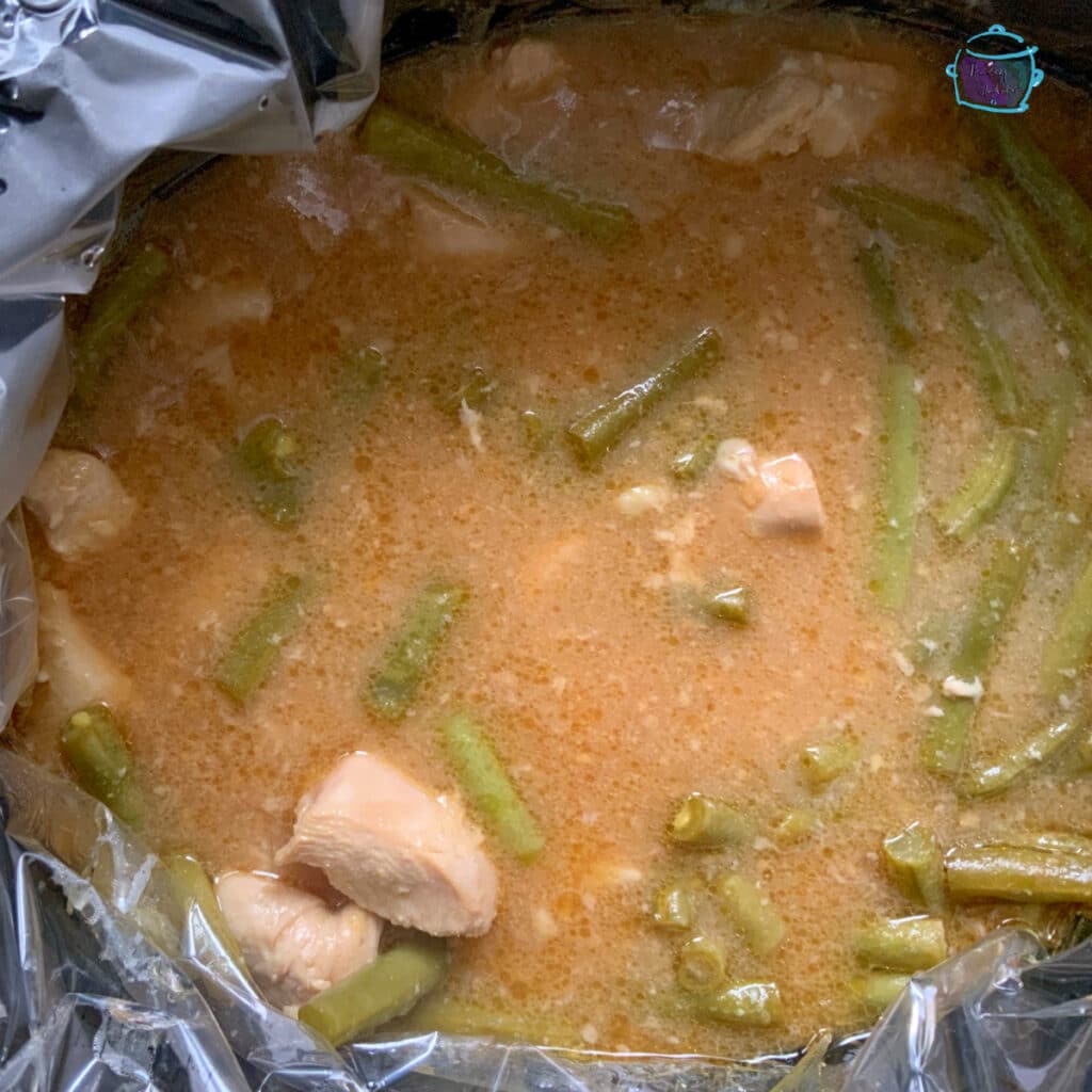 Mandarin orange chicken in slow cooker after cornstarch has been added