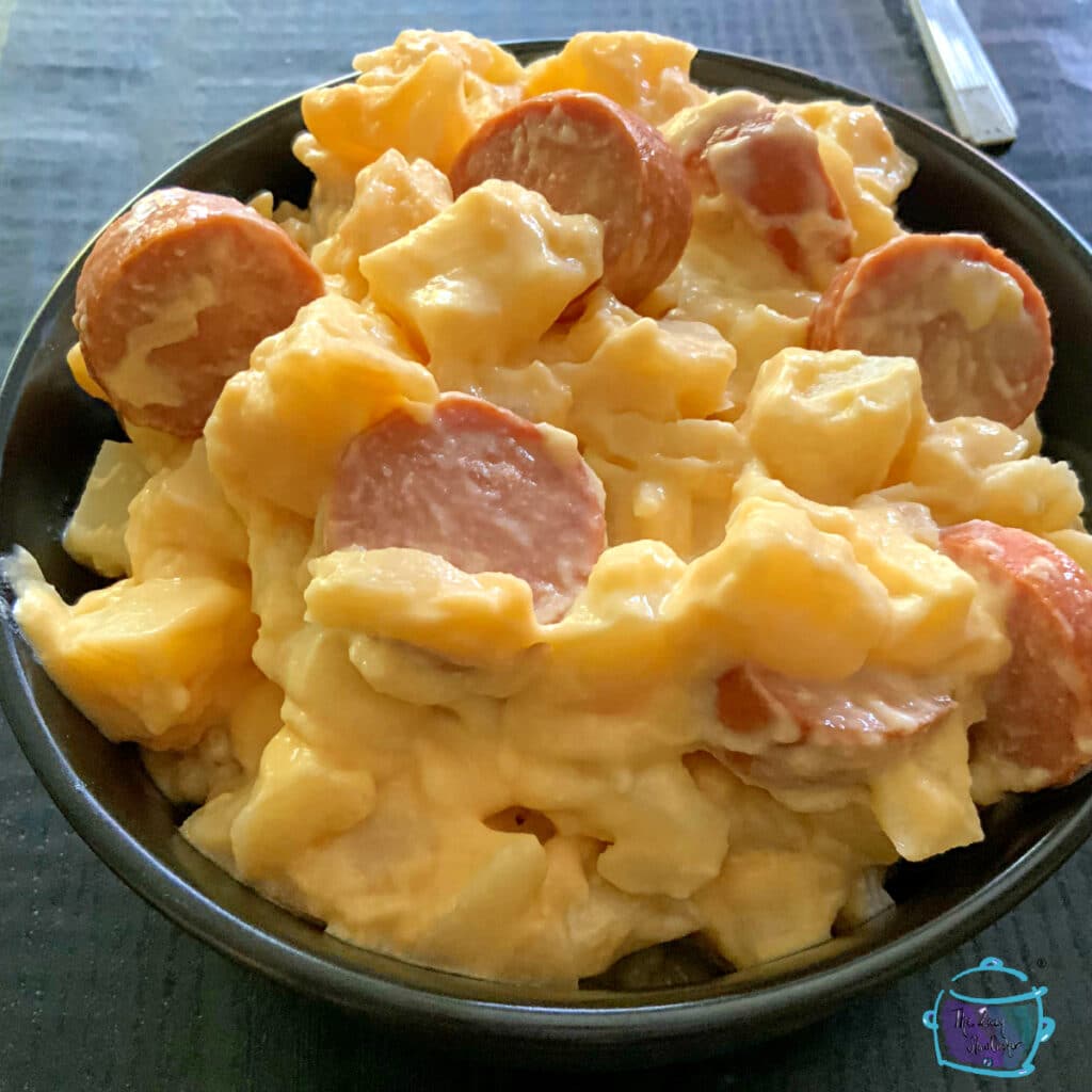 Close up of cheesy potatoes and kielbasa bake