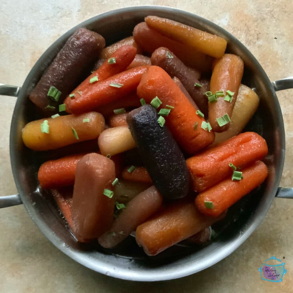 slow cooked maple carrots with chive topping