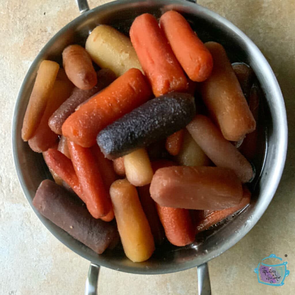 slow cooker maple vanilla carrots in serving dish
