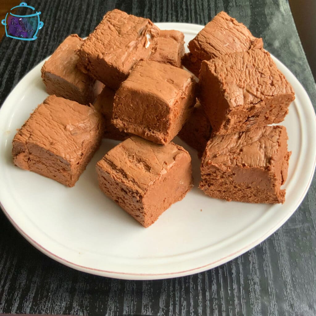 Chocolate fudge pieces on a white plate