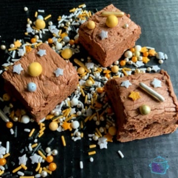 Pieces of fudge decorated with gold and sliver sprinkles