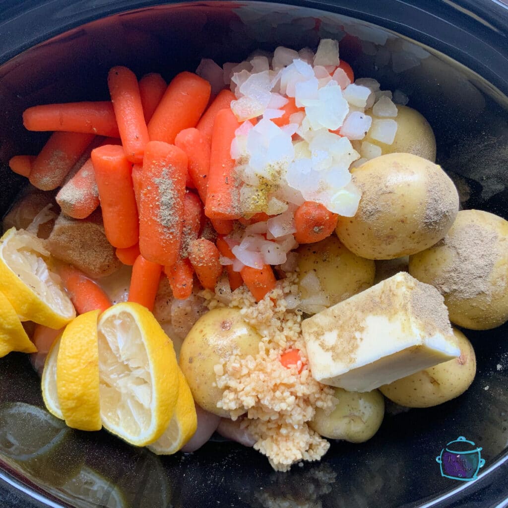 All lemon pepper chicken ingredients in slow cooker ready to cook