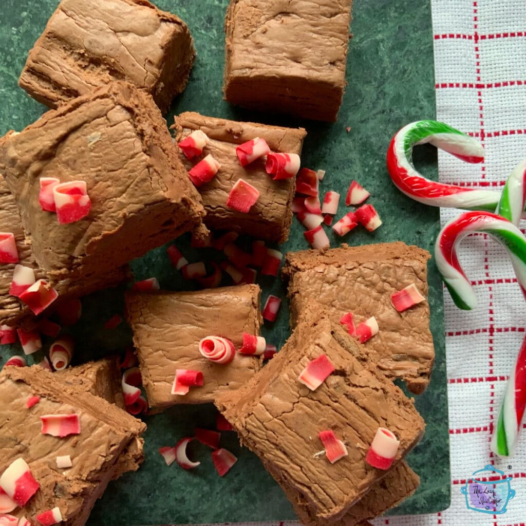 Chocolate fudge pieces with red candy shavings and candy canes