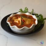 A finished bowl of soup with garnish