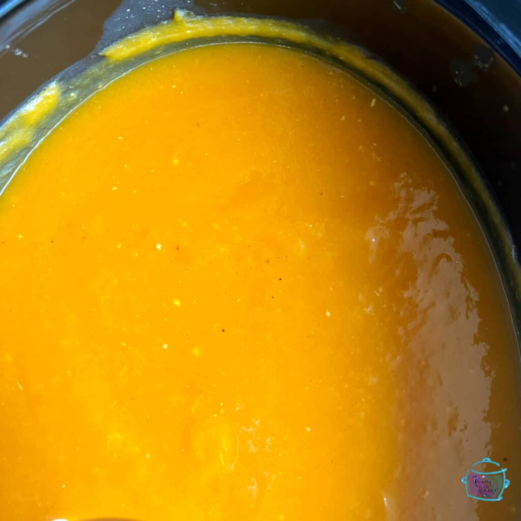 Finished slow cooker pot full of blended butternut squash soup
