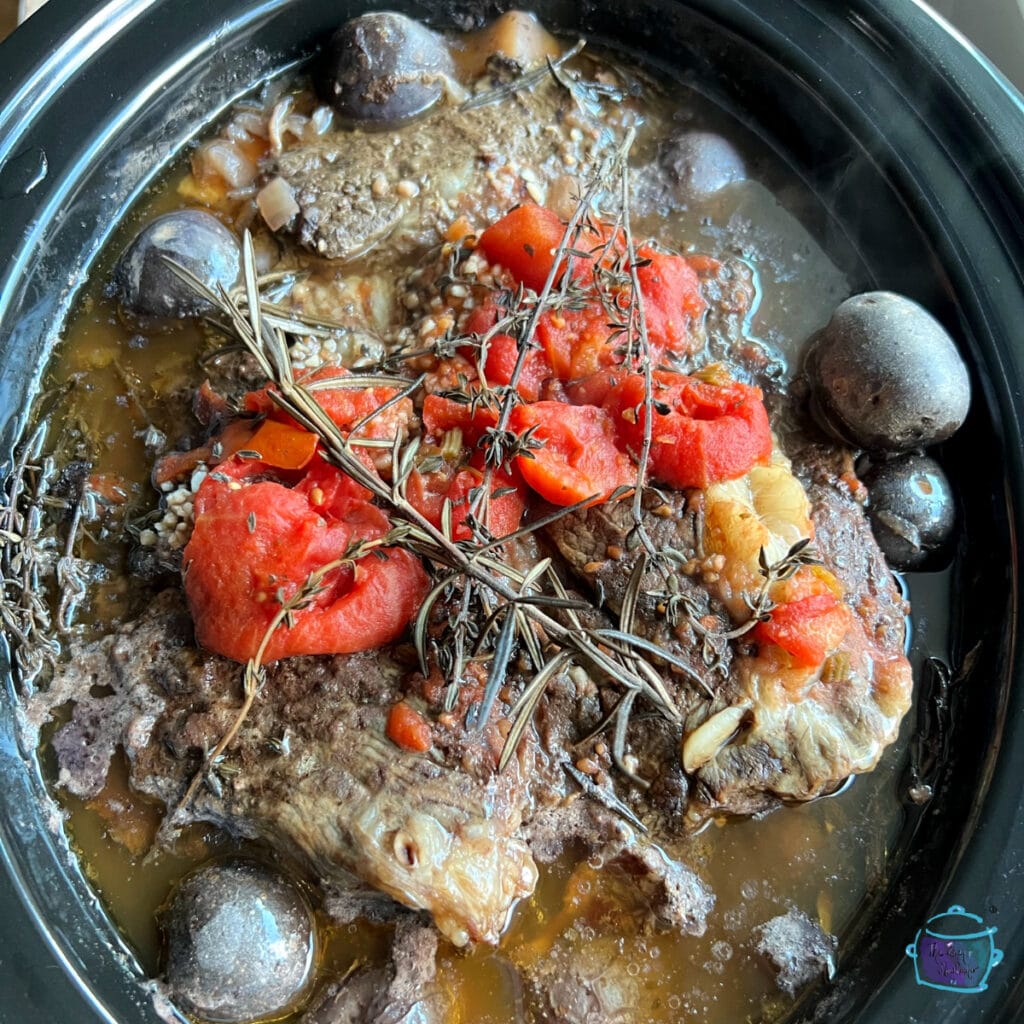 Top view of roast and veggies after cooking time