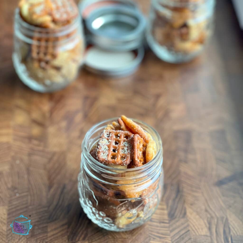 Slow cooker parmesan ranch snack in glass jars