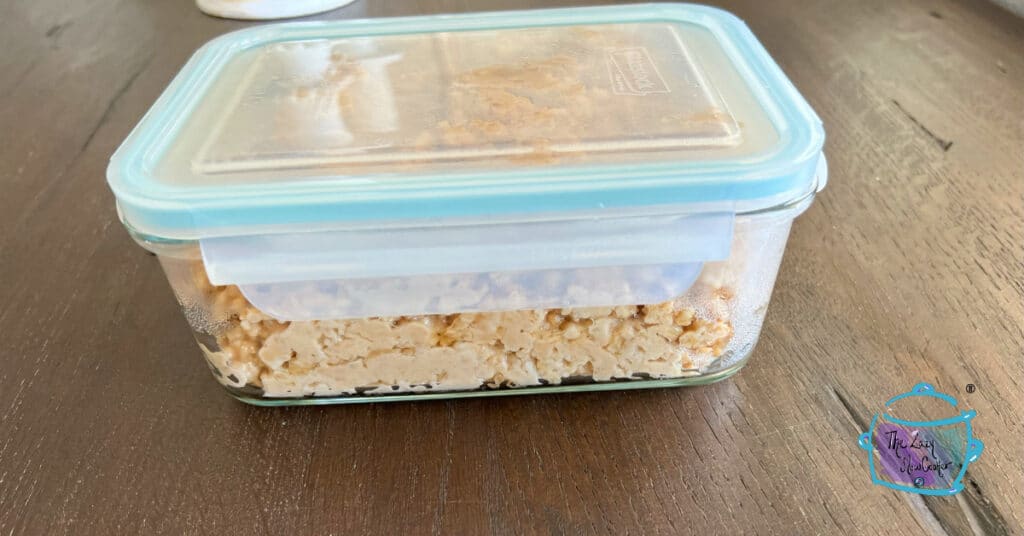 peanut butter oatmeal in a glass storage container.