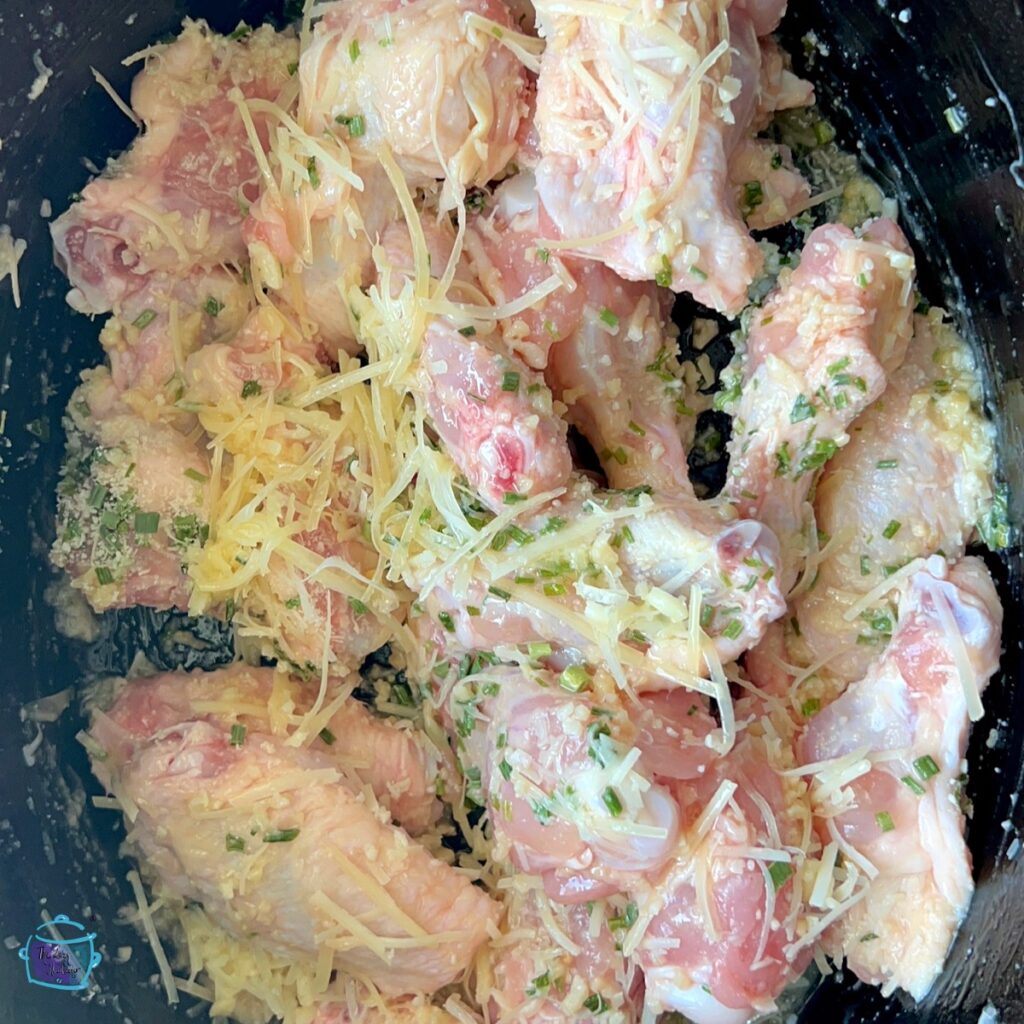 Raw chicken wings covered in garlic parmesan ready to cook!