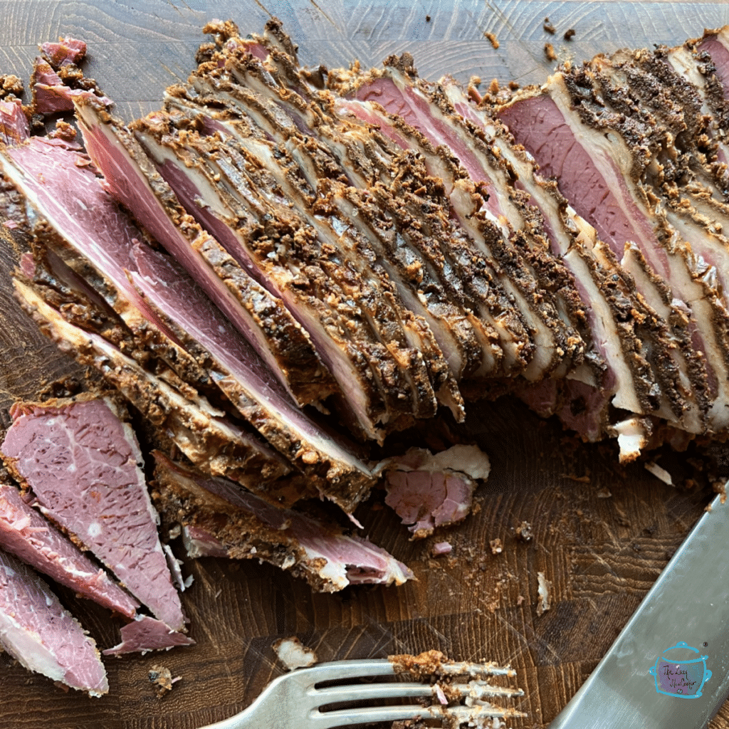 Sliced pastrami on a cutting board