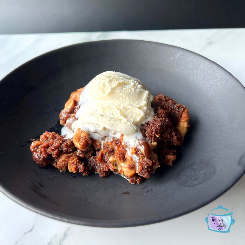 slow cooker spoon brownies on a black plate perfect bbs dessert