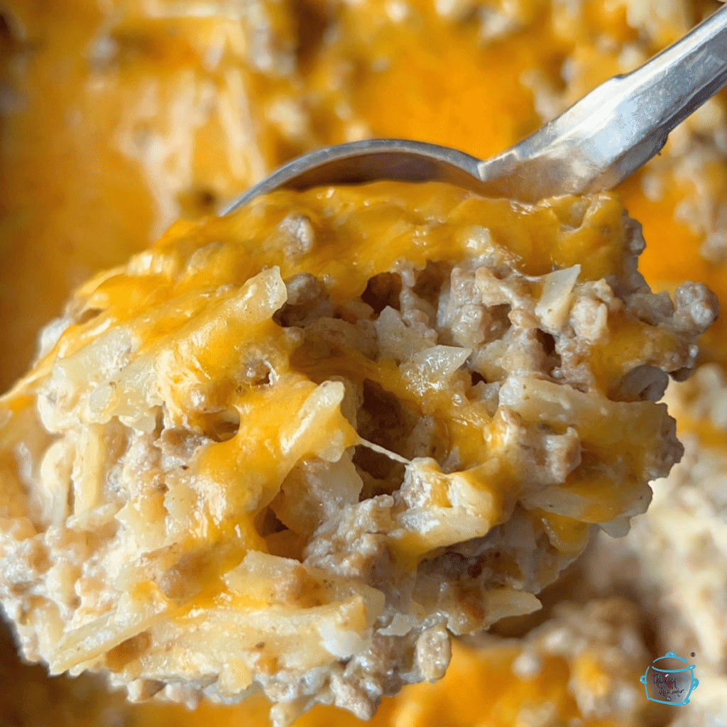 close up of slow cooker hash brown cheeseburger on a spoon