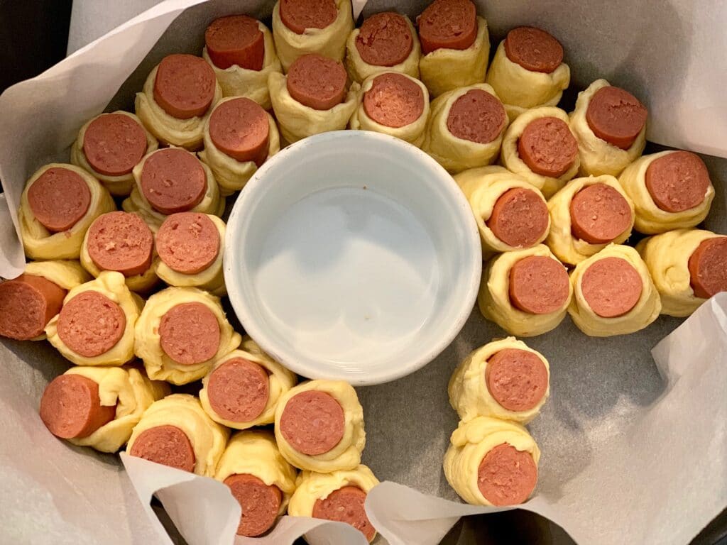 partially assembled hot dog pull apart in a slow cooker