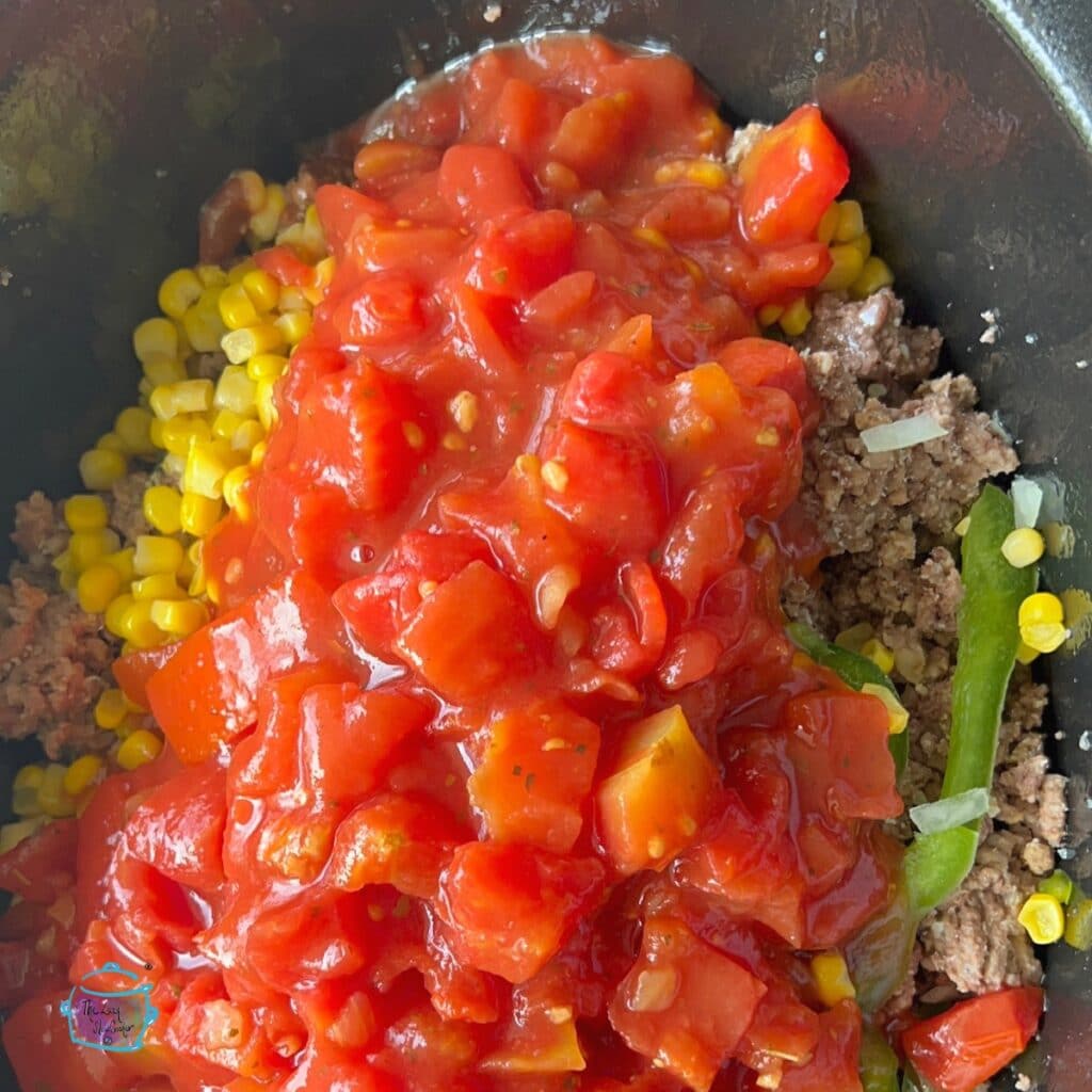 All turkey taco ingredients in the slow cooker before cooking