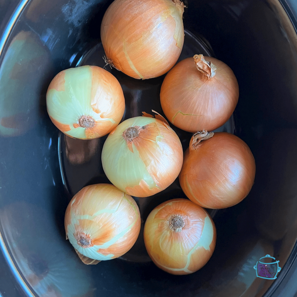 Unsliced onions in a slow cooker