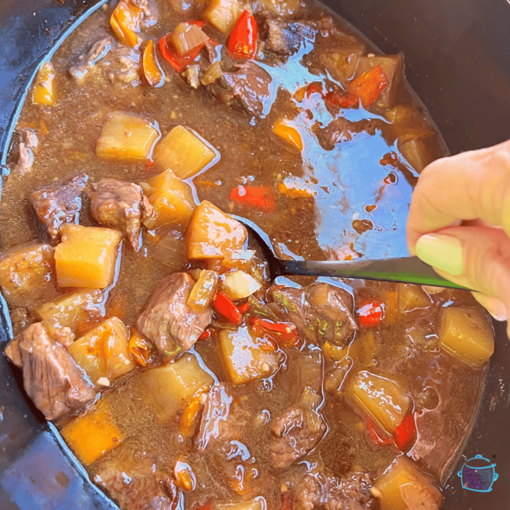 slow cooker Hawaiian beef with pineapple cooked but still in the slow cooker