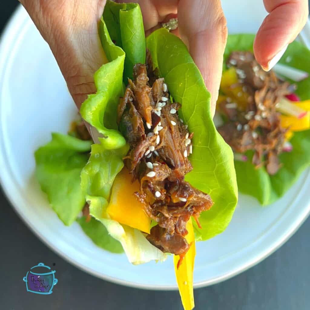 close up of one beef lettuce wrap after slow cooking