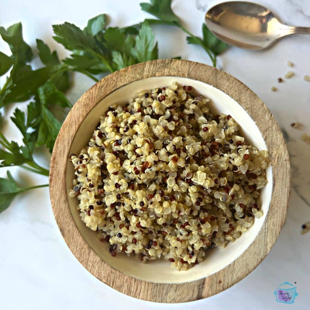 quinoa that was made in a slow cooker displayed in a wooden bowl