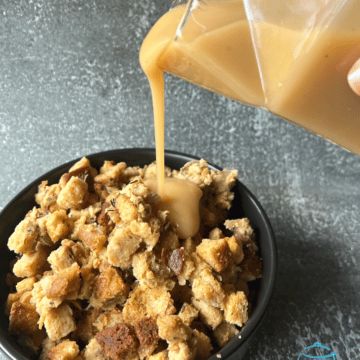 Slow cooker stuffing being doused with gravy!