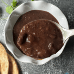 black bean soup after cooking on a soup spoon