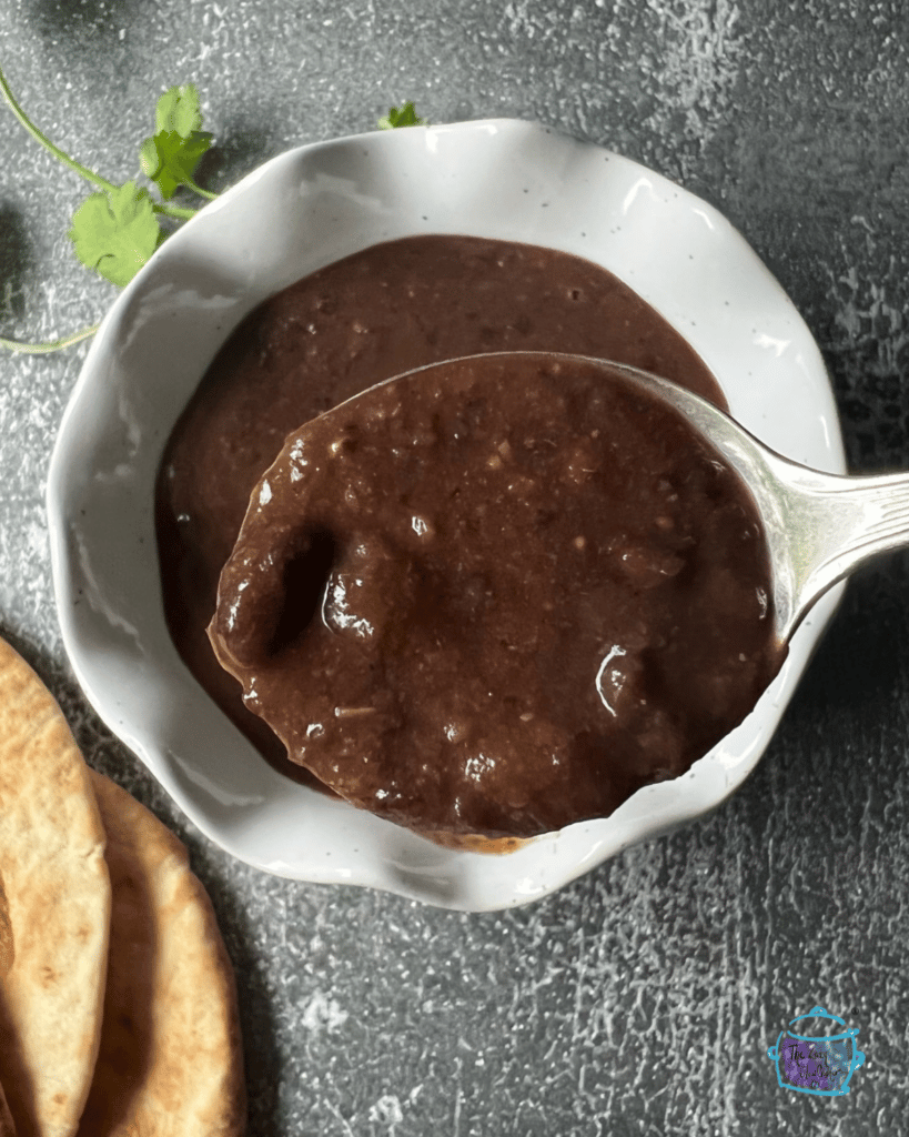 black bean soup after cooking on a soup spoon