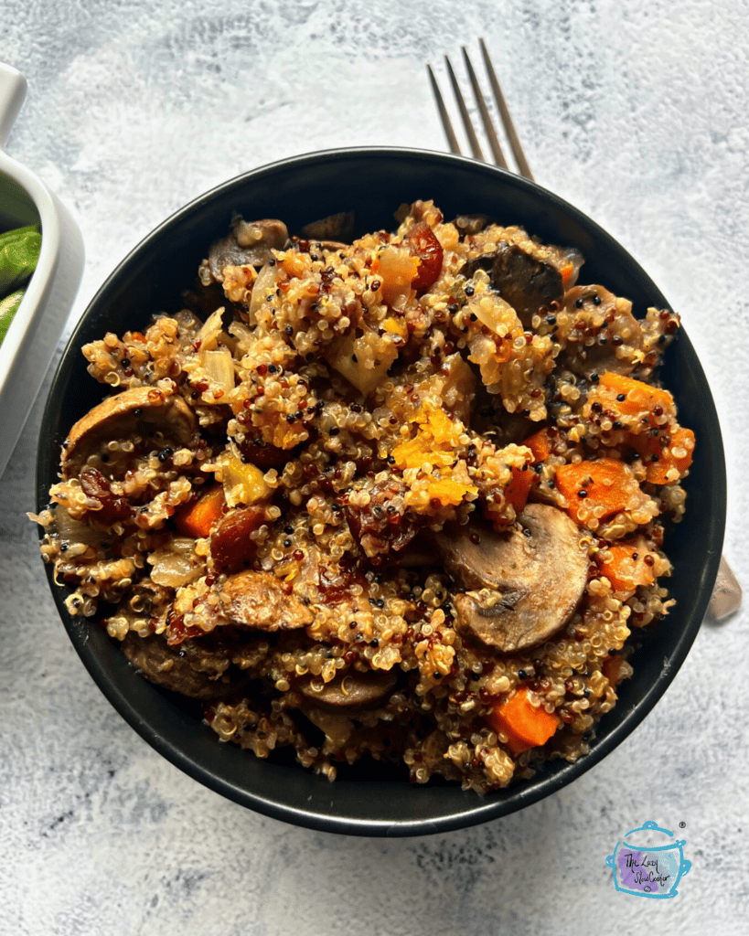 a bowl full of finished quinoa stuffing after slow cooking