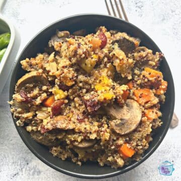 a bowl full of finished quinoa stuffing after slow cooking
