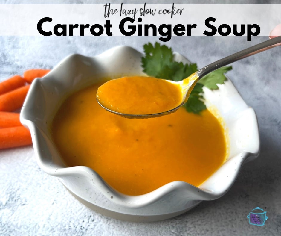 a bowl of ginger carrot soup after slow cooking with some on a spoon