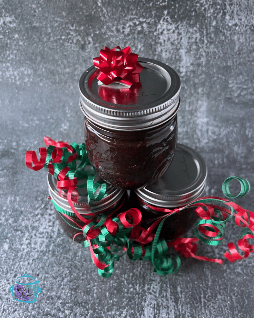 slow cooker maple onion jam in a gift jar wrapped for Christmas