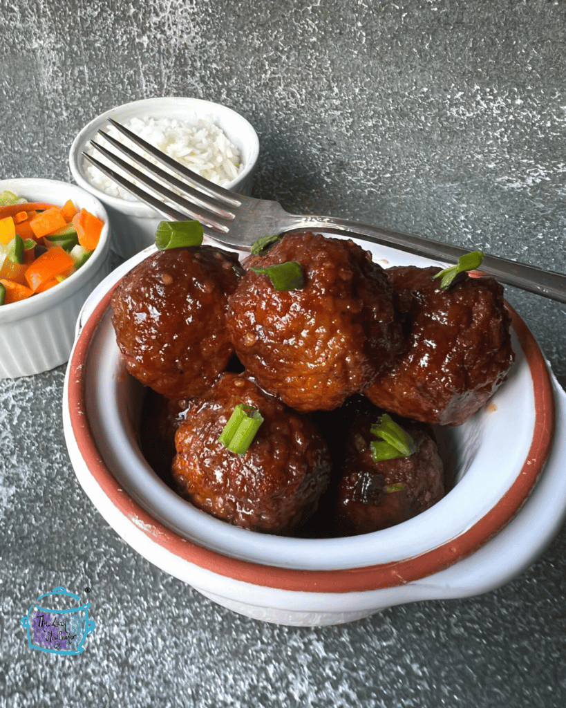 a bowl with honey bourbon crockpot meatballs