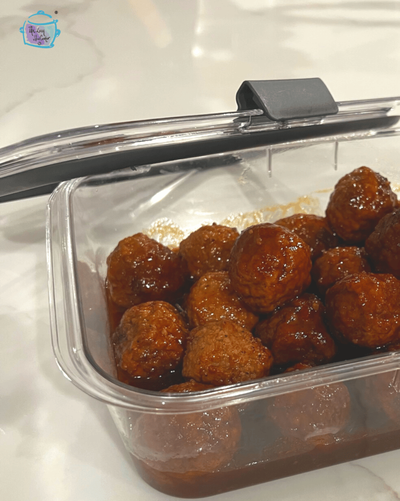 leftover crockpot bourbon meatballs in a storage container