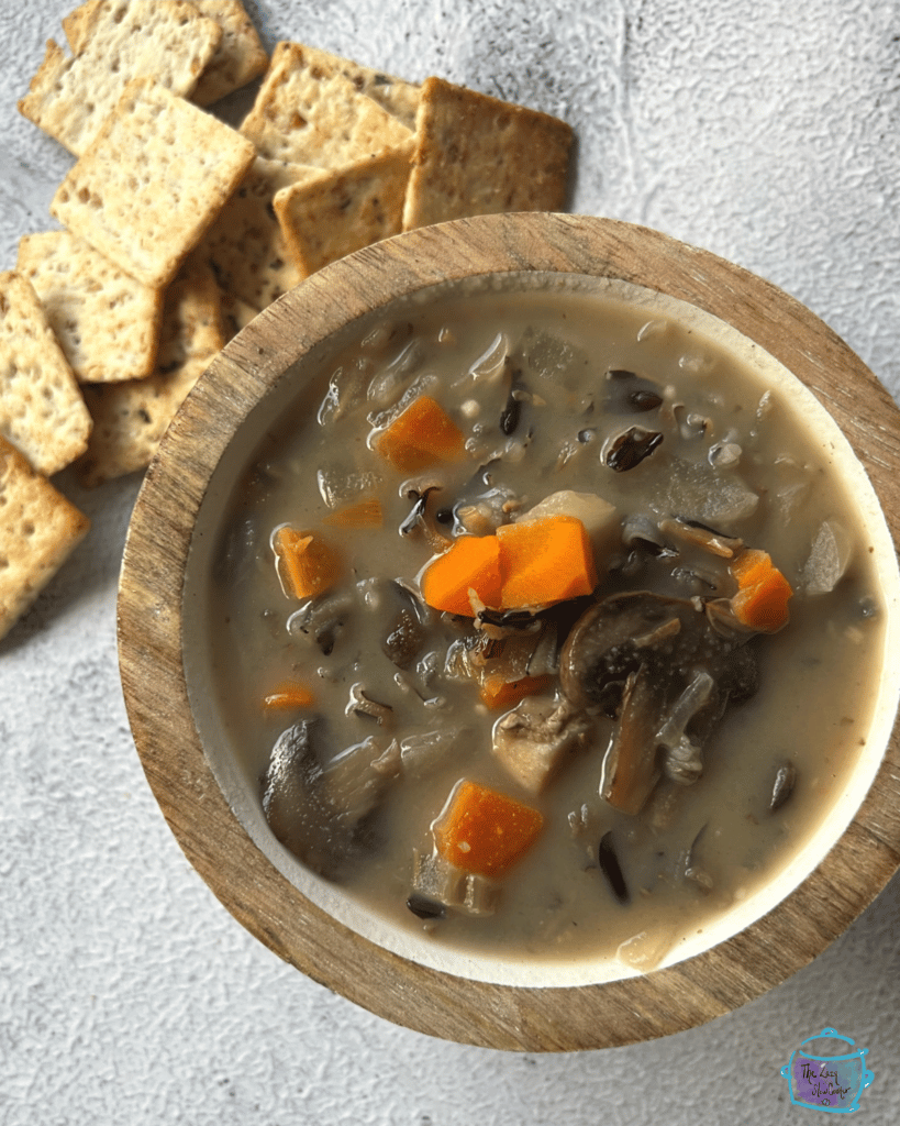 Looking down on a bowl of wild rice and mushroom soup after slow cooking