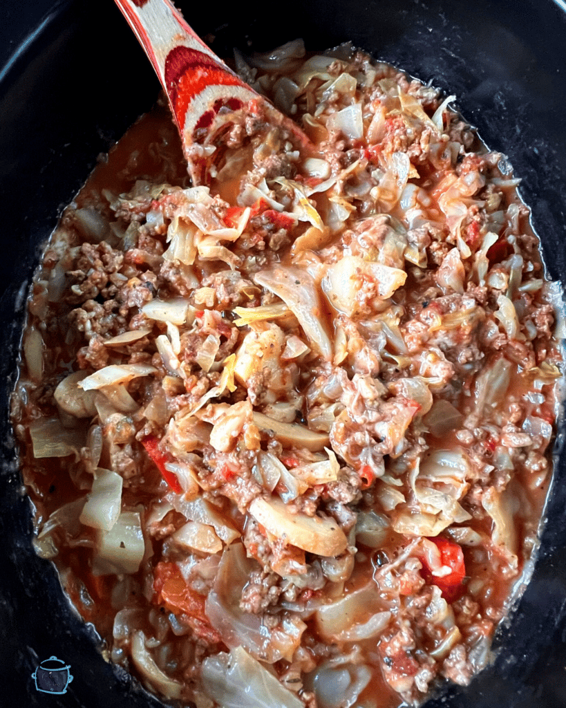 cabbage and beef recipe on a spoon after it is slow cooked