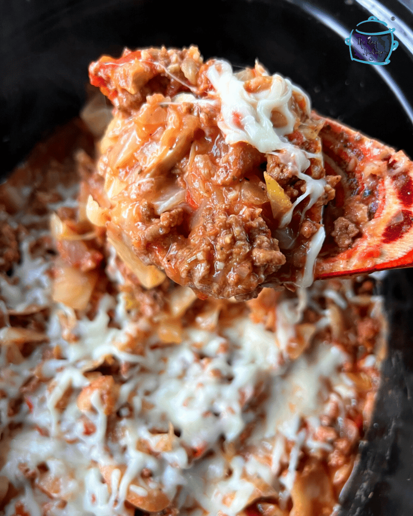 cabbage and beef recipe on a spoon after it is slow cooked