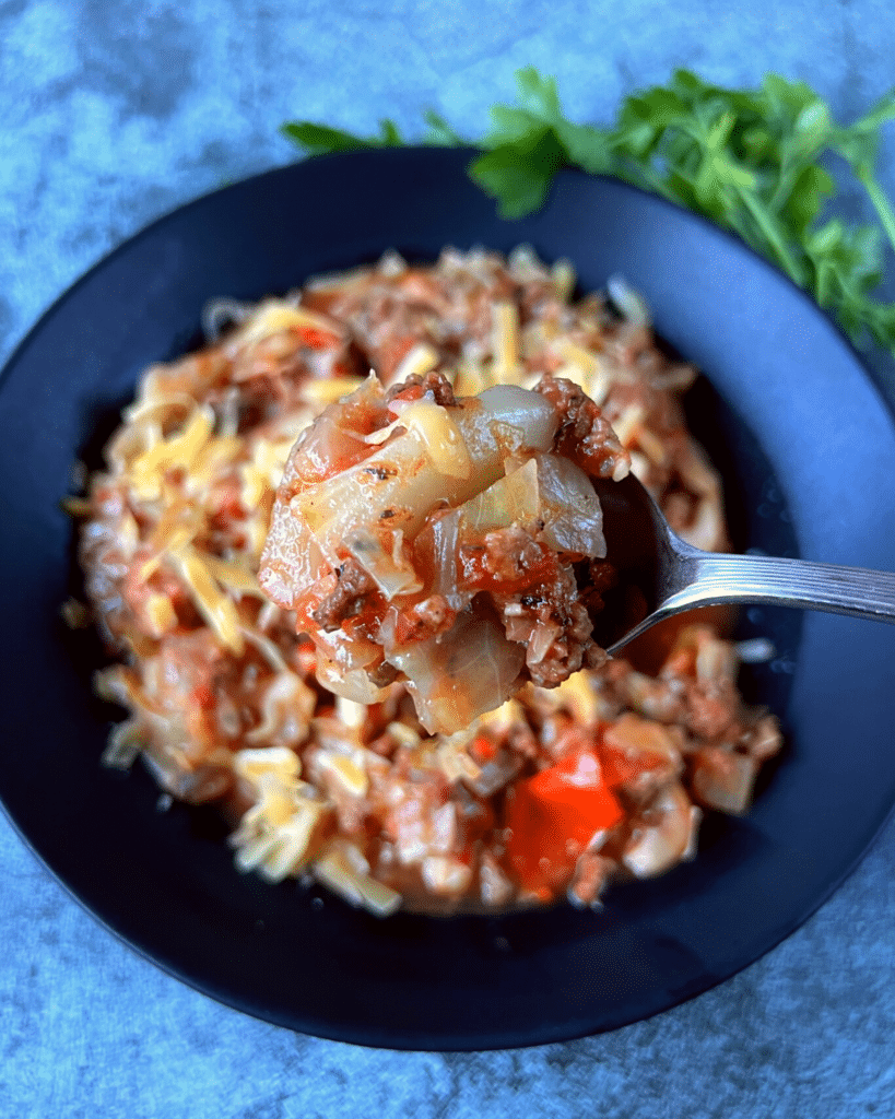 cabbage and beef recipe on a spoon after it is slow cooked