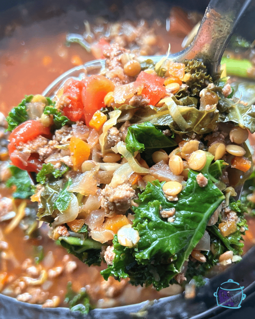 Close up of crockpot lentil and turkey soup on a ladle