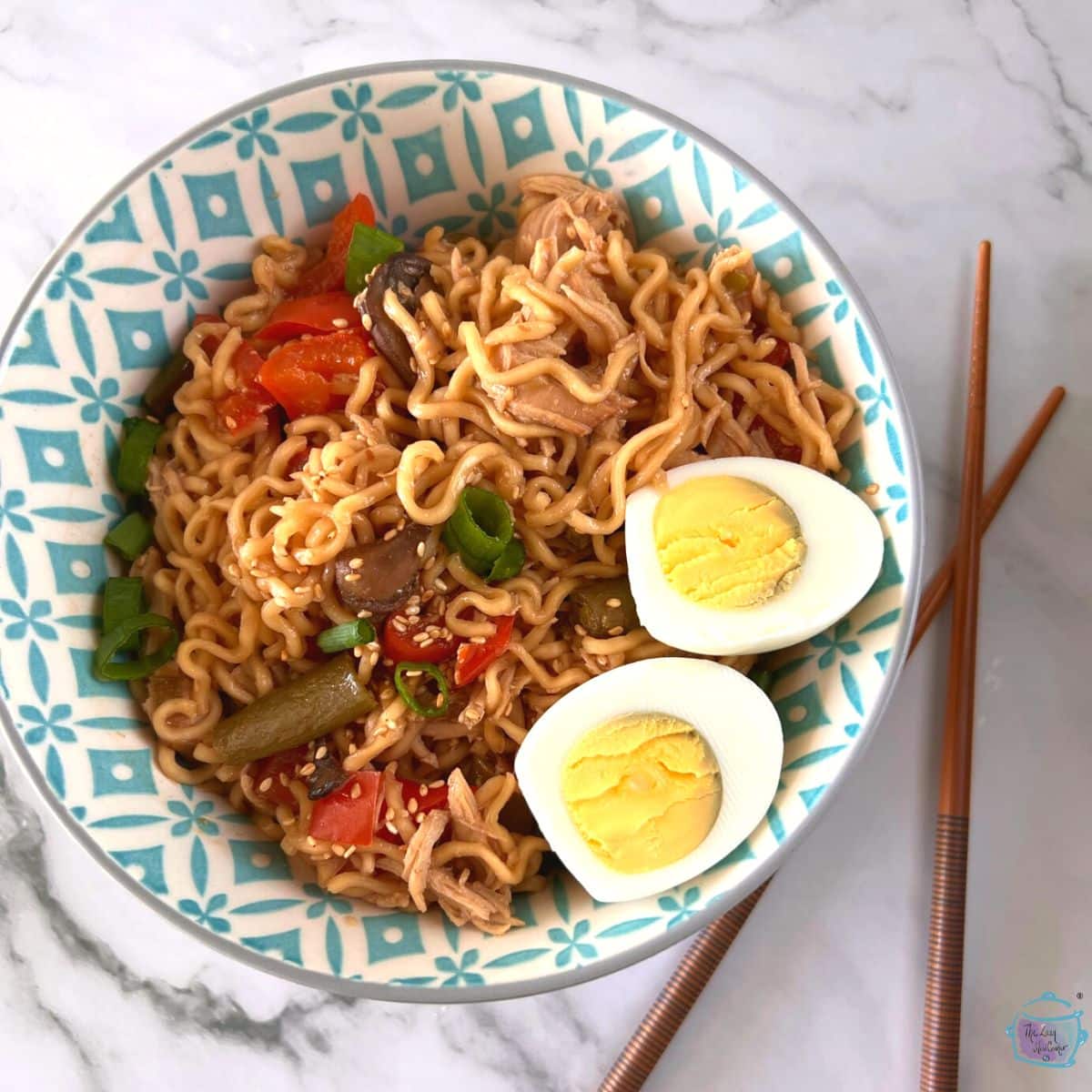 slow cooker ramen noodle with chicken in a bowl with chopsticks