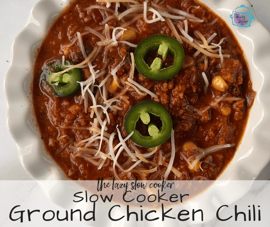 a bowl full of slow cooker ground chicken chili with sliced jalapenos