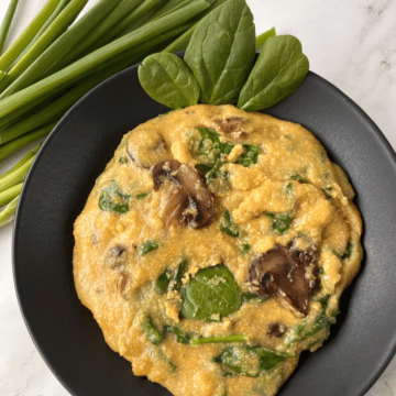 looking down on a bowl of slow cooker polenta with mushrooms and spinach