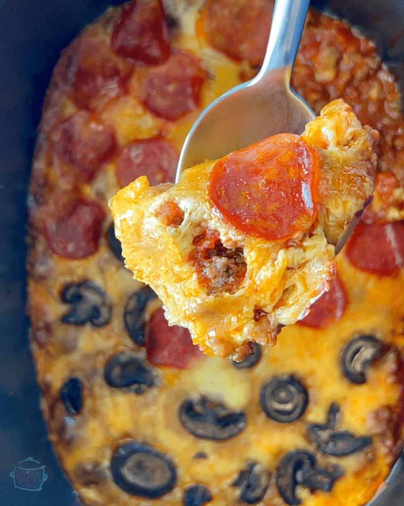 crustless pizza on a spoon over a slow cooker